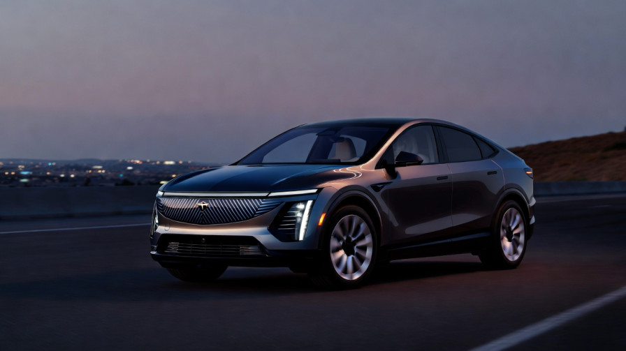 Cadillac LYRIQ electric SUV parked on open road showing full exterior design